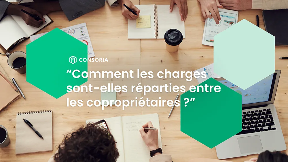 Photo de copropriétaires échangeant sur la répartition de leurs charges de copropriété